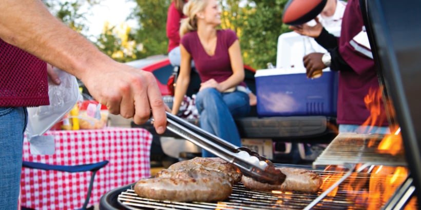 A group of people grilling outdoors