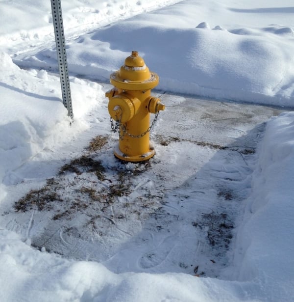 A fire hydrant cleared of snow