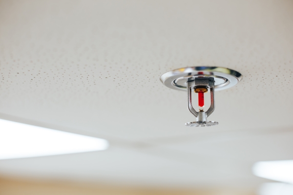 Automatic fire sprinkler system head in a commercial building