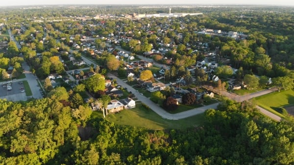 Aerial shot of a suburban area with homes and businesses