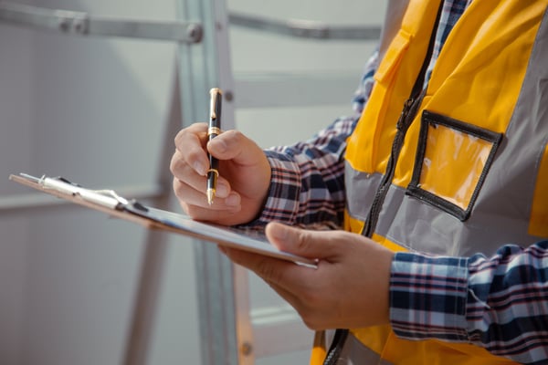 inspector conducts a routine building inspection