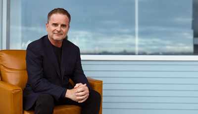 man in chair Karl Newman CEO WSRB